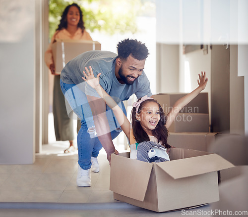 Image of Happy family, real estate and moving in new home with box for property, mortgage loan or celebration. Mother, father and little girl enjoying playing with boxes for fun relocation together in house