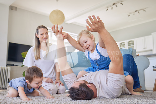 Image of Happy family, parents and children on floor playing, bonding and airplane game time in living room. Home, love and playful energy, mom and dad with kids on carpet, laughing and relax with happiness.