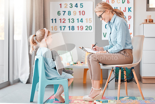 Image of Girl child, psychologist and writing with counseling, smile and listening for support, help and service. Woman, female kid and conversation for mental health, psychology notes and wellness