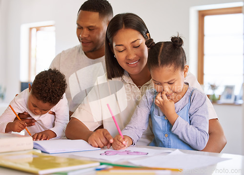 Image of Family, parents help their children with homework and books on desk at their home. Support with writing or reading, education or learning and woman with man helping their kids color in a book