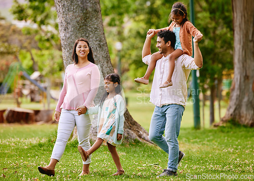 Image of Walking, piggyback and happy family in a park, talking and bonding with love, smile and fun in nature. Children, parents and conversation in forest together on weekend, cheerful and enjoying freedom