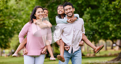 Image of Portrait, piggyback and happy asian family in a park with love, smile and games in nature. Face, freedom and parents carrying children in a forest, bonding and playing together on the weekend outdoor