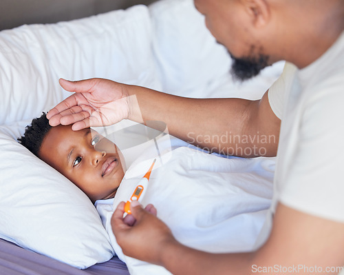 Image of Father, thermometer and sick child in bed with a fever and hand of dad on head to check temperature. Black boy kid and a man together in a bedroom for medical risk, health test and virus problem