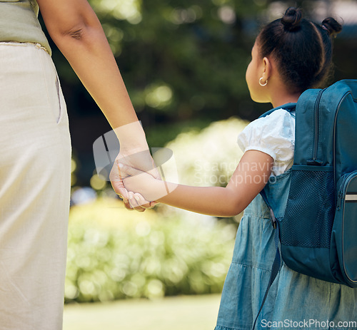 Image of Holding hands, backpack and girl with mother walking to school together outdoor. Hold hand, mom and student walk, travel and journey to kindergarten with care, safety and security, support or bonding