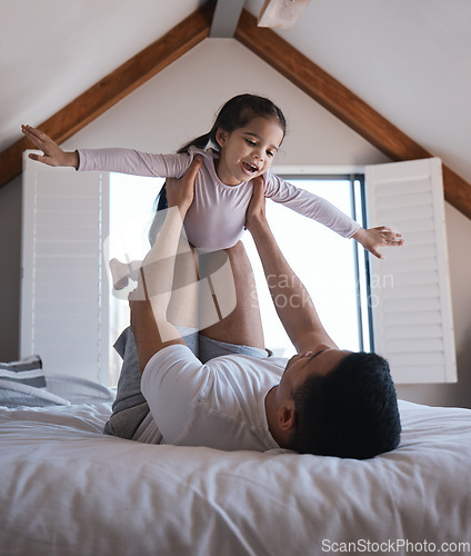 Image of Airplane, game and child with father on a bed happy, playing and bonding in the morning together. Flying, fun and excited girl with parent in a bedroom for creative, fantasy and childhood happiness