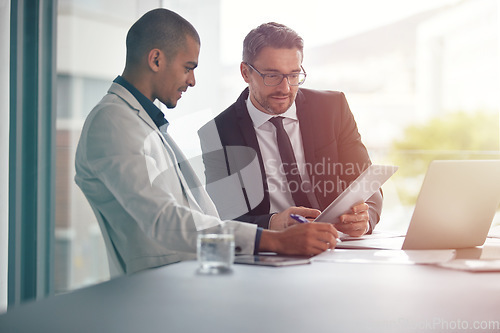 Image of Tablet, teamwork and business men planning in conference room meeting, management and discussion of corporate data. Professional people, partner or manager talking and analysis on digital technology