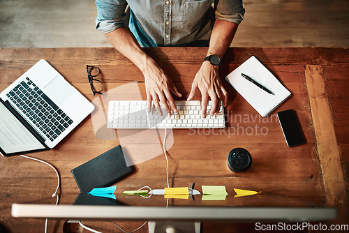 Image of Top view, computer and business man typing for planning, strategy and online data analysis at office desk. Hands of worker, desktop and keyboard for tech, research and productivity in startup agency