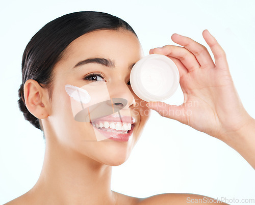 Image of Face, skincare and woman with cream container in studio isolated on a white background. Portrait, dermatology product and happy female model with beauty cosmetics, creme or lotion for healthy skin.