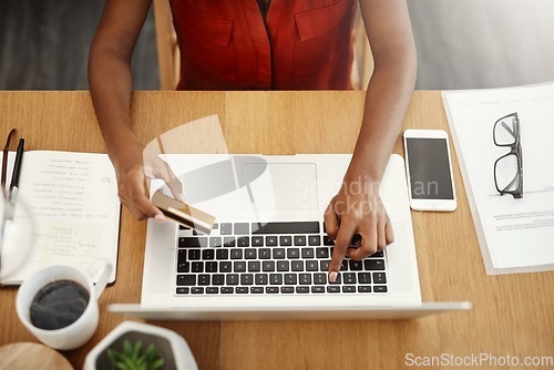 Image of Credit card, laptop and payment with hands of woman for online shopping, ecommerce or internet store. Above female entrepreneur at desk with keyboard for banking, booking website for business