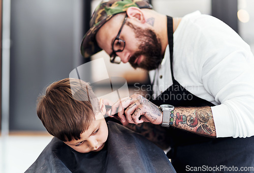 Image of Just tilt your head a little. Cropped shot an adorable little boy getting a haircut at the barbershop.