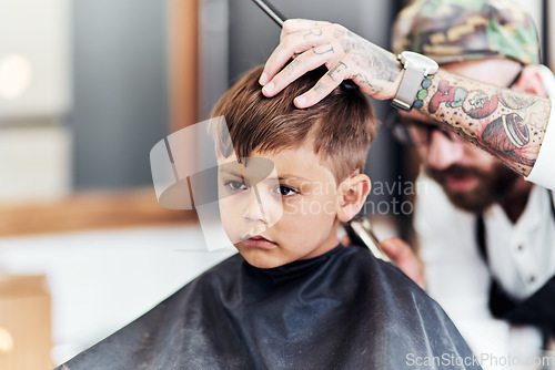 Image of Youre never too you to start looking your best. Cropped shot an adorable little boy getting a haircut at the barbershop.