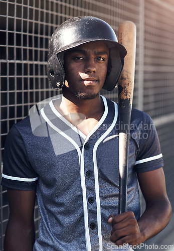 Image of Quitting is not an option. Shot of a young man holding his bat at a baseball game.