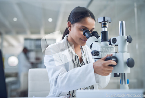 Image of Science, microscope and innovation with a woman in a laboratory for medical research or experiment. Healthcare, medicine and a young indian engineer working in a lab for pharmaceutical development