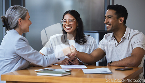 Image of Smile, couple and handshake with financial consultant for deal, agreement or contract. Happy, man and woman shaking hands of broker for finance, loan or mortgage, welcome and thank you for investment