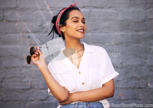 Image of Fashion, smile and Indian woman with ideas, thinking and confident lady against grey wall with sunglasses. Female person, ideas and happy girl with eyewear, casual outfit or streetwear with happiness