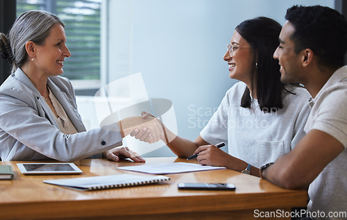 Image of Happy, couple and handshake with financial advisor for deal, agreement or contract. Smile, man and woman shaking hands of broker for finance, loan or mortgage, welcome and thank you for investment.