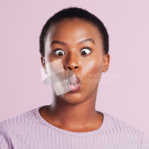 Image of Female person, funny and squinting eye with pink studio background in closeup in africa with emoji and closeup. Woman, eyes and silly faces and mouth with meme and weird expression for comedy.