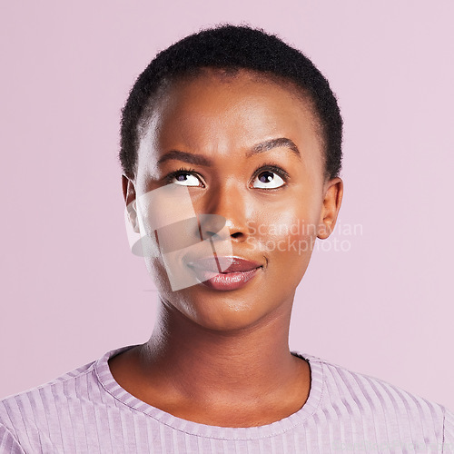 Image of Woman, annoyed and face in pink studio background with skin in africa for emoji. Female person, silly and faces with eye roll with thinking expression for beauty and skincare with smile for youth.