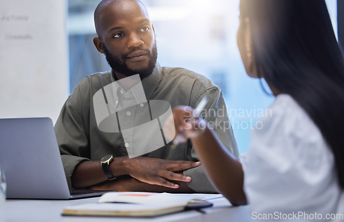 Image of Business man, meeting and listening to discussion in office for collaboration, team and planning ideas together. Black male, employees and conversation of project, work and hearing feedback in agency