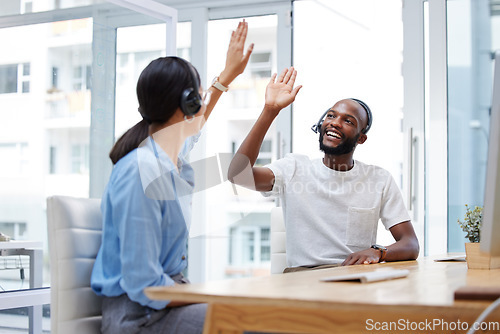 Image of High five, call center and people teamwork, support or coworking success, winning or achievement in office. Happy african man, partner or woman hands together for telemarketing sale, target or goals