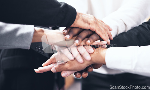 Image of Business people, meeting and hands together for teamwork, unity or collaboration at the office. Hand of group touching for team agreement, motivation or support in trust, solidarity or integration