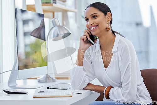 Image of Business woman, company phone call and smile in a office with communication at a desk. Content manager, web worker and female person with tech and connectivity for internet strategy conversation