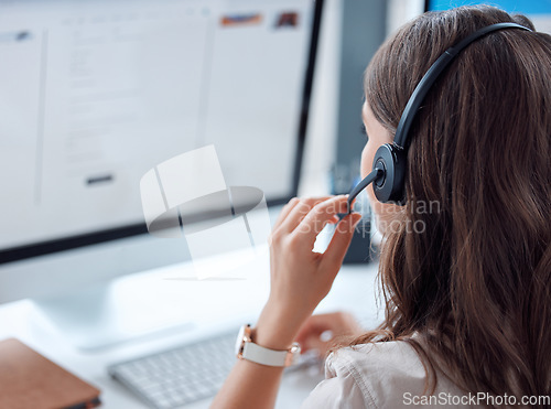 Image of Customer support, call center and back of female agent working on online consultation in the office. Telemarketing, communication and saleswoman planning crm with headset and computer in workplace.