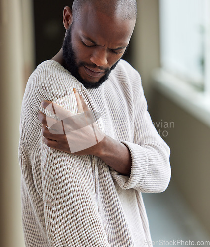 Image of Shoulder, pain and black man with injury, home and muscle tension with strain, health issue or emergency. Male person, accident or guy with medical problem, inflammation or joint with body tendinitis