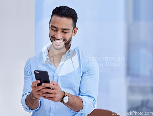 Image of Happy asian man, phone and smile for communication, social media or chatting at the office. Businessman smiling and typing on mobile smartphone app for texting, online chat or networking at workplace