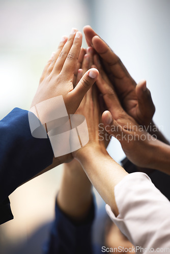 Image of High five, celebration and hands of business people for team building, meeting or collaboration. Unity, diversity and closeup of group of employees with success, achievement or teamwork to celebrate.