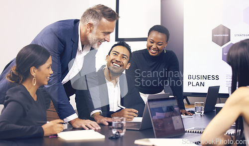 Image of Collaboration, meeting and planning with a business team laughing in the boardroom during a strategy workshop. Diversity, teamwork and funny with a group of colleague in the office for brainstorming