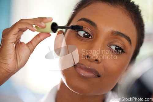 Image of Face, woman with mascara and makeup routine for beauty skincare at her home. Cosmetics or wellness, dermatology or self care and closeup female person with protection brush for eyelashes at her house