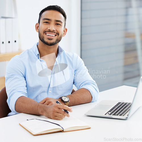 Image of Portrait, businessman writing in a book and with laptop smile at desk of his modern work office. Success or happiness, write in notebook and excited male person sit at table of his workstation