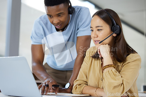 Image of Call center, customer service and manager helping a consultant with crm communication in the office. Contact us, headset and telemarketing agents working on online consultation together in workplace.