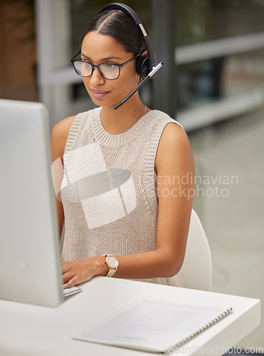 Image of Business woman, call center and web support communication at a computer in a office. Phone conversation, professional and worker with contact us, crm and customer service job in a consulting agency