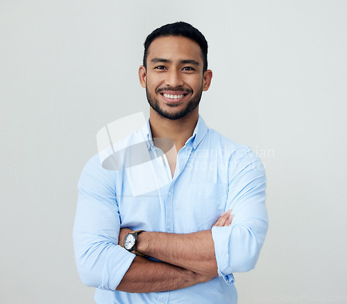 Image of Economist, portrait and business man with arms crossed in studio isolated on a white background. Face, confidence and happy Asian male professional, entrepreneur or analyst from Singapore with mockup