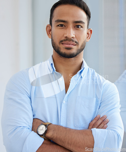 Image of Portrait, accountant and business man with arms crossed in office, workplace or company. Face, confidence and serious Asian male professional, entrepreneur or auditor from Singapore with career pride