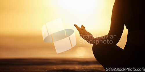 Image of Silhouette, mockup and person doing meditation at the beach for wellness, health and zen or spiritual in morning sunrise. Balance, shadow and athlete meditate or yoga to be calm, workout and healthy