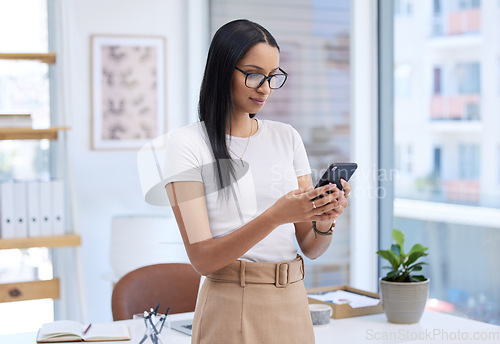 Image of Business woman with smartphone, chat and typing with social media, communication and connectivity in workplace. Female professional on break, mobile app with text message and using phone at office