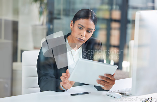 Image of Business woman, tablet and typing in a office with web designer working on ui information. Internet research, young female worker and thinking of a employee on a app for digital project and work
