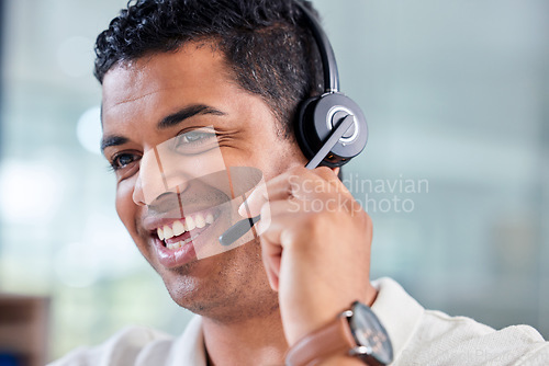 Image of Happy, smile and male customer service consultant working on an online consultation in the office. Confidence, contact us and man call center or telemarketing agent with headset for crm communication