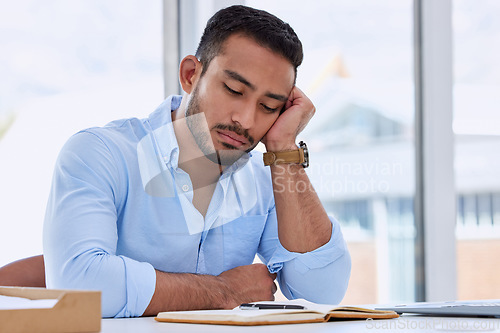 Image of Tired, sleeping and business man in office for fatigue, exhausted and overworked. Mental health, burnout and frustrated with male employee napping at desk for problem, overtime and stress