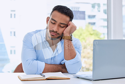 Image of Tired, laptop and sleeping with business man in office for fatigue, exhausted and overworked. Mental health, burnout and frustrated with male employee napping at desk for problem, overtime and stress