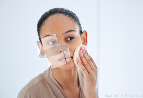 Image of Beauty, face and woman doing a scrub for skincare, self love and cosmetic care for natural skin in the morning. Bathroom, cleaning and young female person clean or grooming with a product or sponge