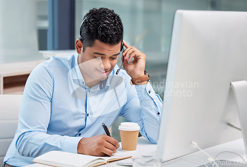 Image of Call center, man and communication with notes for customer service, tech support and CRM consulting. Male agent, consultant and writing in notebook for telemarketing, advisory help and telecom sales