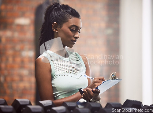 Image of Entrepreneur, clipboard and woman in a gym, inventory and exercise with inspection for hygiene, checklist or startup. Female person, employee or athlete with documents, planning or training equipment