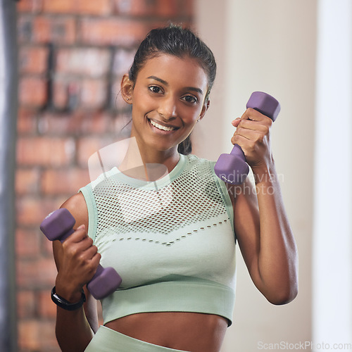 Image of Smile, gym and portrait of woman with dumbbell for fitness, workout goals and healthy mindset with energy. Sports, exercise and happy face of girl with weights for training and muscle building body.