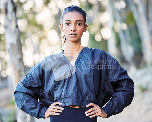 Image of Fitness, nature or portrait of girl runner in training, exercise or workout with resilience or wellness. Face, motivation or healthy sports woman on exercising or running break in forest or woods