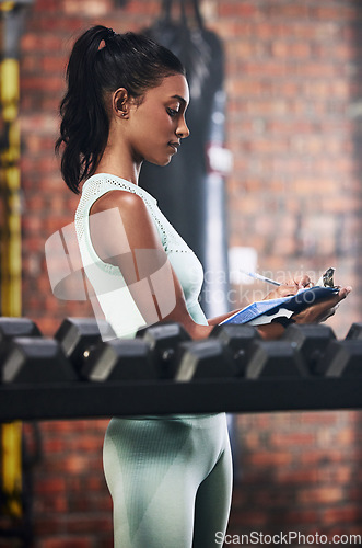 Image of Personal trainer, gym or woman writing dumbbells or checking weights info for inspection checklist. Fitness business, girl or entrepreneur with inventory documents for training equipment monitoring