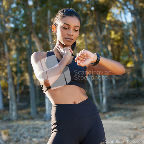 Image of Pulse, smartwatch or girl runner in nature to check heart rate health or monitor training or exercise progress. Rest, track or Indian woman with timer for running exercise, workout or fitness in park